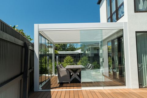 Glazed louvre room with sliding doors